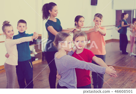 smiling little boys and girls dancing pair dance 46608501
