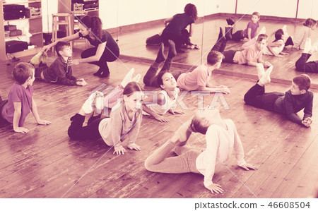 Children exercising in dance hall 46608504