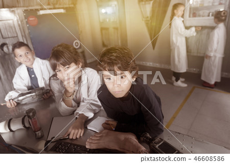 children solve tasks in the bunker quest room 46608586