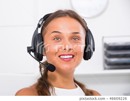 young woman with head set at office. 46609226