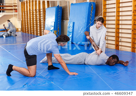 People fighting with coach at gym People fighting with coach at gym 46609347