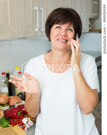 mature woman talking phone 46609484