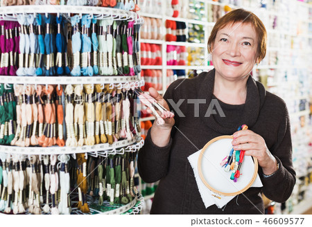 Woman buying embroidery accessories Woman buying embroidery accessories 46609577