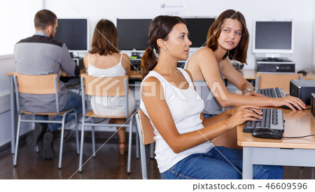 Female students studying in computer class Female students studying in computer class 46609596