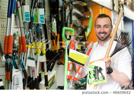 Man with gardening tools in the shop 46609682
