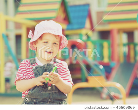 two-year child at playground two-year child at playground 46609869