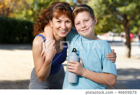 Family during break in outdoors workout Family during break in outdoors workout 46609878