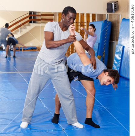 Two men practicing self defense techniques Two men practicing self defense techniques 46610166