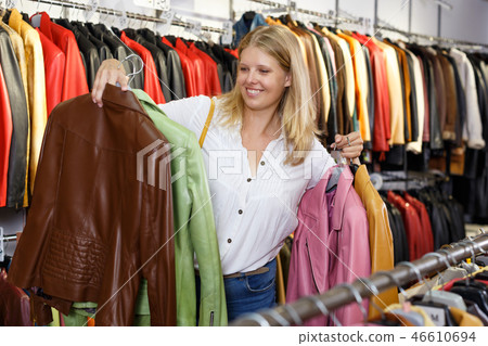 Woman choosing leather jacket 46610694