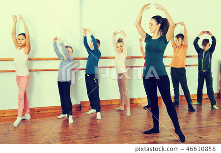 Young ballet dancers exercising in ballroom 46610858