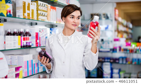 Female pharmacist suggesting useful body care products Female pharmacist suggesting useful body care products 46611051