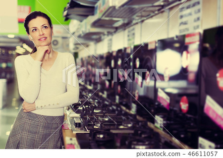 Woman selecting new cooking top 46611057