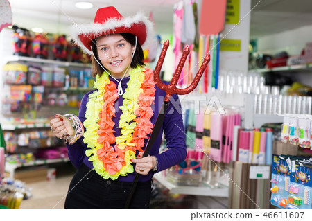 Happy girl shopper having fun in festival outfits store 46611607