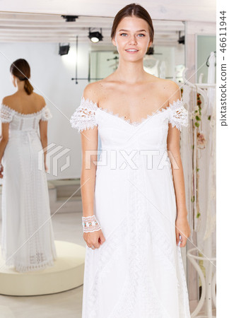 Girl fitting wedding dress Girl fitting wedding dress 46611944