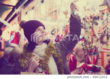 Teenager with Christmas decoration 46612022