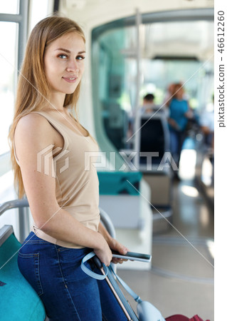 Woman traveling by subway train Woman traveling by subway train 46612260