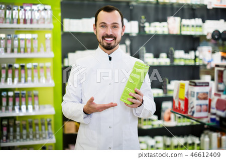 Male pharmacist in pharmacy Male pharmacist in pharmacy 46612409
