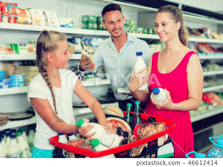 Family with child are selecting milk Family with child are selecting milk 46612414