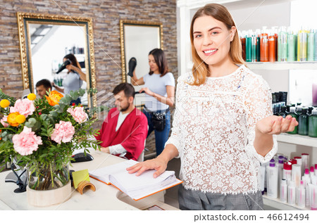 Portrait of young woman administrator inviting to beauty salon 46612494