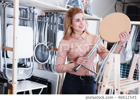 woman choosing comfortable backless stool 46612545