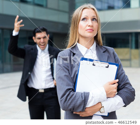 Sad woman is upset with the reprimand for the results of the financial report Sad woman is upset with the reprimand for the results of the financial report 46612549