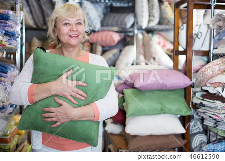 mature woman consumer with pillow 46612590
