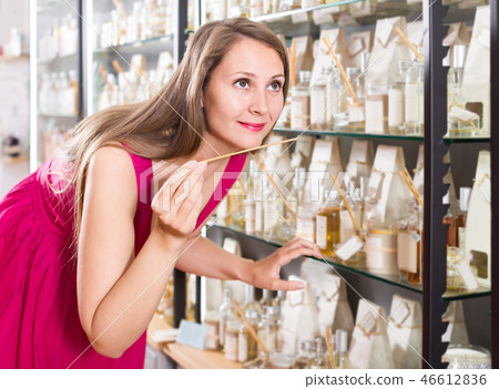 woman take a choise fresh perfume in perfume supermarket woman take a choise fresh perfume in perfume supermarket 46612836