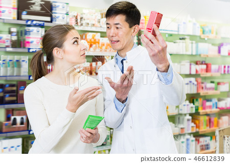 Active client asking pharmacist about medicines Active client asking pharmacist about medicines 46612839