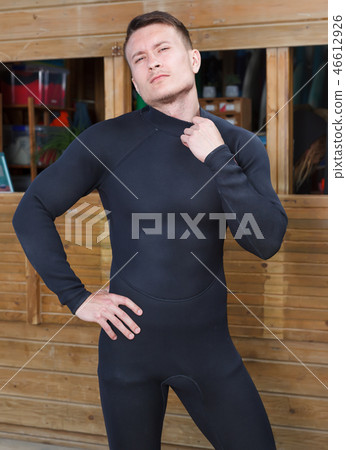 man instructor in wetsuit for surfing 46612926