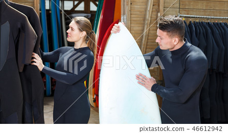 Athletic guy inspecting rented equipment 46612942