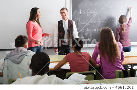 Man giving a math lesson 46613201