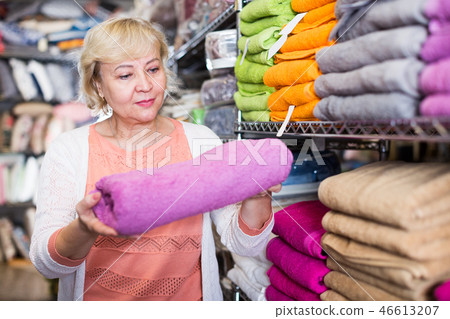 mature woman consumer holding towel mature woman consumer holding towel 46613207