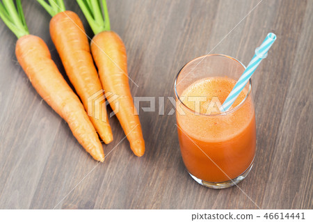 A glass of healthy carrot smoothie with carrots 46614441