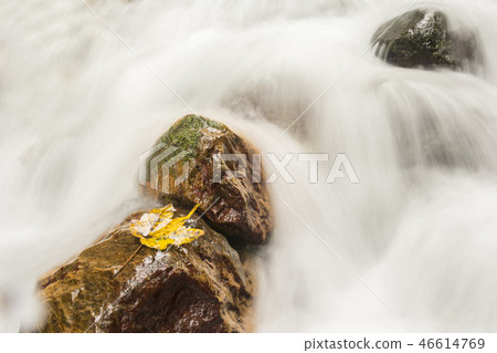 Three stones on flowing waterfall with single Three stones on flowing waterfall with single 46614769