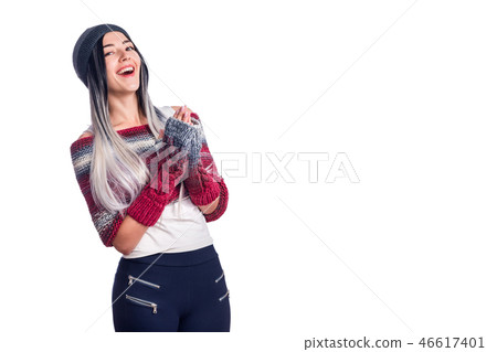Beautiful cool girl wearing colored ombre hair extensions gesturing in hat and knitted clothes Beautiful cool girl wearing colored ombre hair extensions gesturing in hat and knitted clothes 46617401