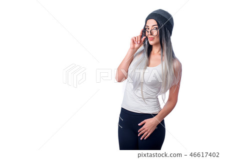Beautiful cool girl wearing colored ombre hair extensions and glasses gesturing in studio. Portrait Beautiful cool girl wearing colored ombre hair extensions and glasses gesturing in studio. Portrait 46617402