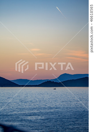 Sunset seascape Ionian Sea and small fishing boat Sunset seascape Ionian Sea and small fishing boat 46618565