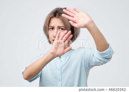 Woman showing her denial opinion on situation 46620362