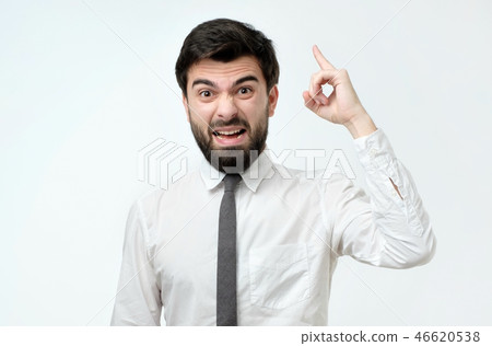 Angry man in ite and white shirt screaming 46620538