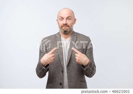 Surprised and doubted guy in suit asking Who, Me. Surprised and doubted guy in suit asking Who, Me. 46621001