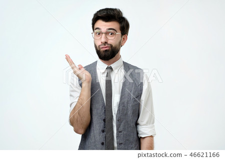 Doubtful bearded young spanish man looking with mistrust. 46621166