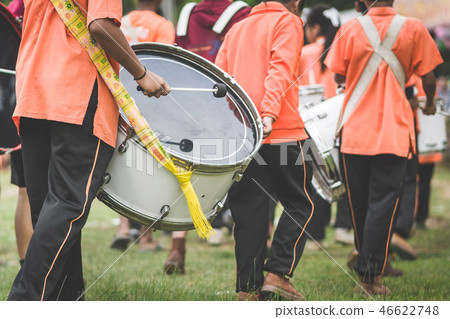 Marching band drummers perform in school parade Marching band drummers perform in school parade 46622748