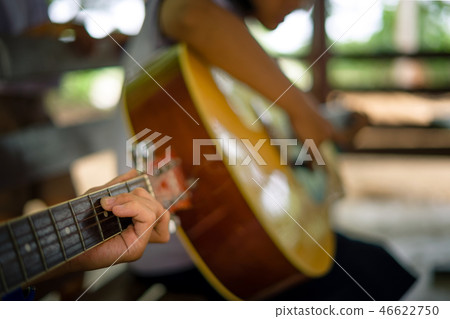 students are learning how to play guitar in school students are learning how to play guitar in school 46622750