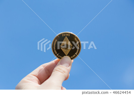Etherim coin and hand 46624454