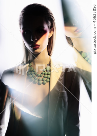 Sexy lady in colorful neacklace and white jacket Sexy lady in colorful neacklace and white jacket 46625856