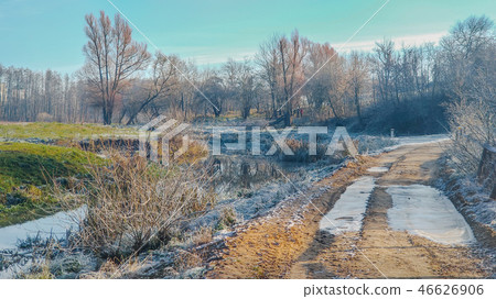 winter rural landscape, trees, rough country road. winter rural landscape, trees, rough country road. 46626906