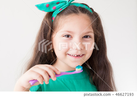 little girl brushing his teeth with a toothbrush dentistry tooth little girl brushing his teeth with a toothbrush dentistry tooth 46627193