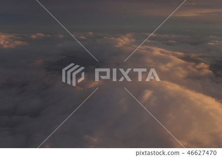 Sky with clouds at sunset from inside the plane landscape 46627470