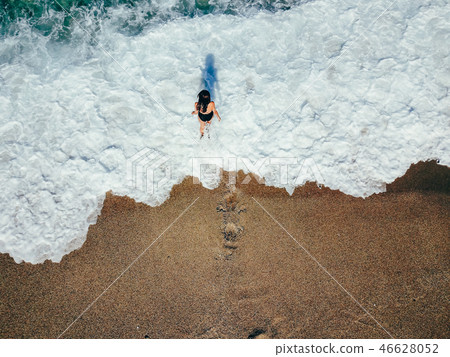 Aerial top view young woman on the sand beach 46628052