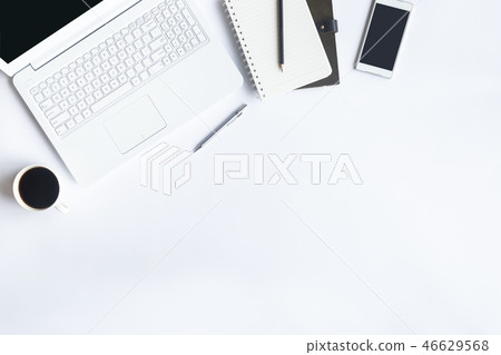 White desk office with laptop, smartphone and othe White desk office with laptop, smartphone and othe 46629568